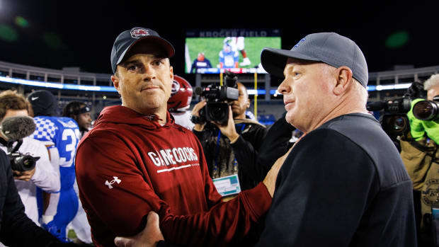 Oct 8, 2022; Lexington, Kentucky, USA; South Carolina Gamecocks head coach Shane Beamer and Kentucky Wildcats head coach Mark Stoops shake hands after a game at Kroger Field. Mandatory Credit: Jordan Prather-USA TODAY Sports